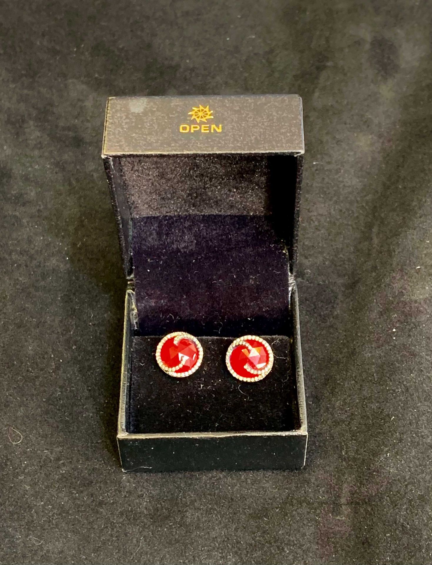 Pair of Circular Earrings, Opaque Red Stone surrounded by Small (Agate) Diamonds complete in White