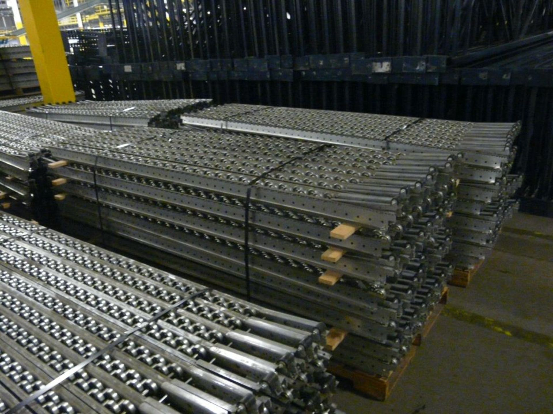 Lot of (2) Bundles of Staggered Metal Wheel Pallet Flow Conveyor Rollers w/Stops - 12.5'L x 4"W;