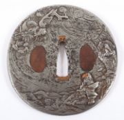 <de>TSUBA, Eisen, rund, im Relief Drache über Wasser, Dm 8,5, min. korrodiert, JAPAN, 19.Jh.</de>