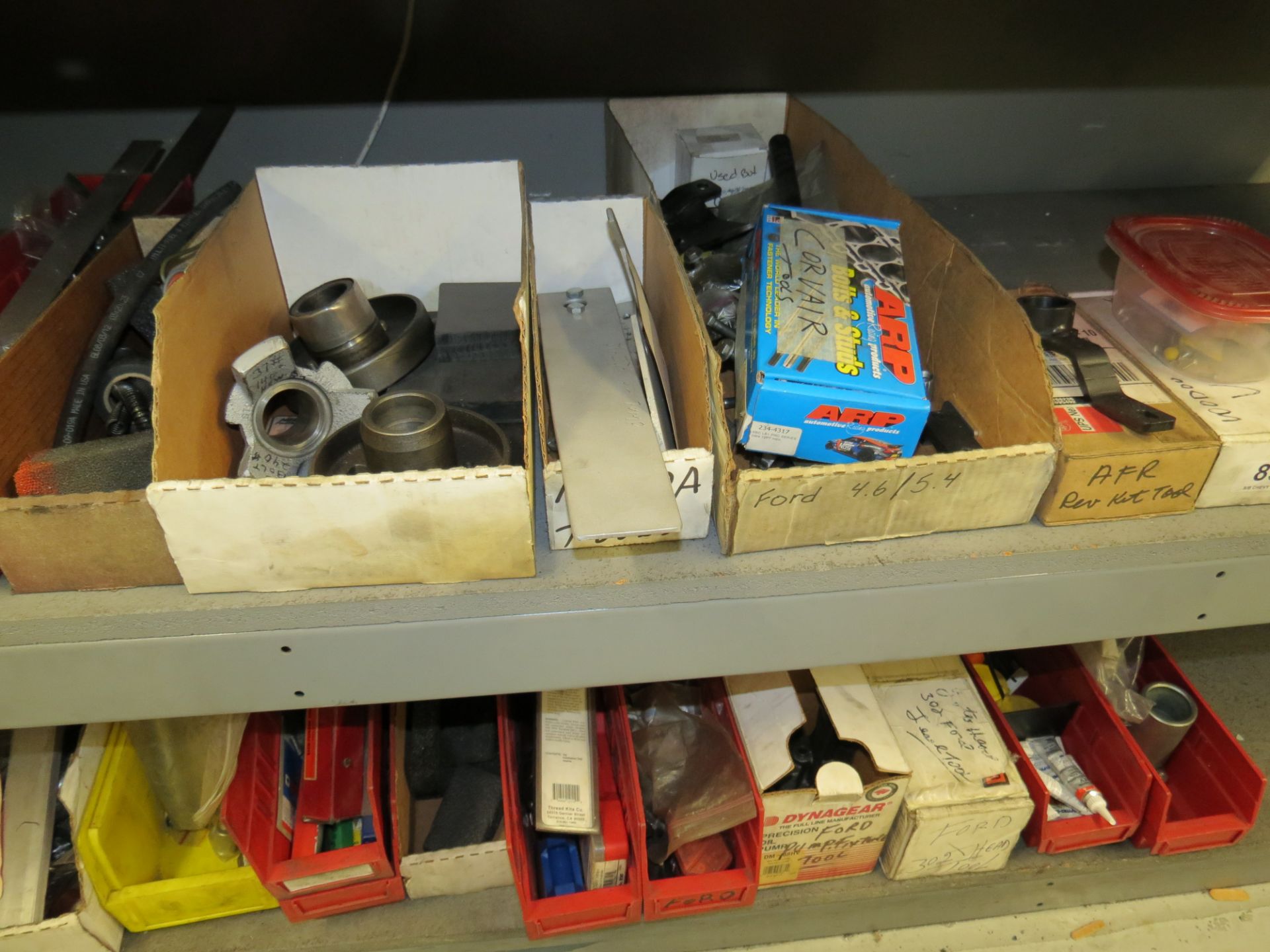 LOT OF ASSORTED PARTS, CLAMPS, ADHESIVES , BOLTS, ON WALL AND BELOW BENCH (2) SHELVES - Image 5 of 6