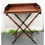 George III late 18th century mahogany butlers tray with brass corner fittings upon a turned