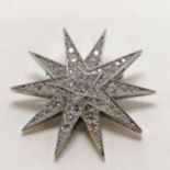 Silver star brooch set with CZ - 4.2cm across & 11g