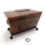 Antique flame mahogany veneered tea caddy box on ball / claw feet with egg and dart mounding