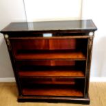 Walnut and ebonised low bookcase with ormolu mounts and relief moulded ceramic panels, some slight