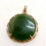 Circular jade pendant in a metal mount - 2.5cm diameter