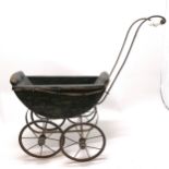 Antique black painted dolls pram, handle cracked and upholstery needs attention, 68cm long x 64cm