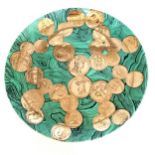 Fornasetti plate with gilded coin decoration - 26.5cm diameter and has wear to gilding & has 3