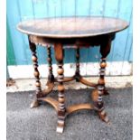 Oak stretcher based circular side table with a carved skirt and 6 bobbin turned legs - 75cm diameter