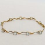 9ct marked gold bracelet set with 9 blue topaz stones & 2 diamonds - 18cm long & 3.6g total weight