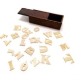 Antique hand carved bone alphabet in original mahogany box (8cm x 3cm x 2cm high) - missing