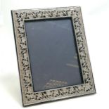 Large silver fronted picture frame with pierced flower decoration & easel stand back - 32cm x 25cm ~