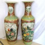 Pair of impressive floor standing Chinese Canton baluster vases with extensive decoration of flowers