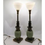 Pair of green ceramic and brass lamp bases with white glass shades - 85cm high