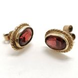 9ct marked gold pair of garnet earrings - 3.2g total weight