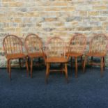 Five Ercol dining chairs including one carver Condition reportAll have splits to the back rail