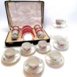 Boxed china coffee cups & Saucers with silver cup holders by Bishop, total silver weight 112g T/W