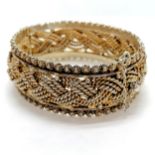 Good quality silver gilt filigree heavy gauge bangle. Foreign marks to clasp, 63g. approx 18cm