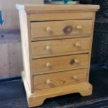 Small table top pine 4 drawer chest. 42cm high x 30cm wide x 25cm deep