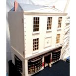 Large scale hand made dolls house on Grove Road with 2 shops (greengrocers + milliners) with 4