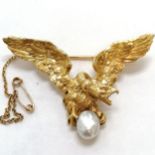 Antique heavy cast gold (continental marks to pin & catch) roc / vulture brooch carrying a pearl -