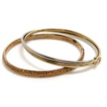 2 x 9ct hallmarked gold bangles (the white / yellow gold bangle has a small dent) - total weight