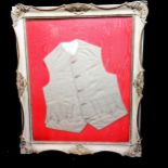 Antique silk child's waistcoat, framed, frame is 48cm x 57cm