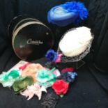 2 vintage hats with black hat box and silk flower decorations