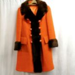 1960's orange coat with brown fur trim. size small