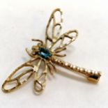 Unmarked 9ct gold dragonfly brooch set with a blue stone - wingspan 4.5cm & 3.6g total weight