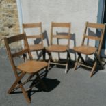 Set of four antique beech folding chairs