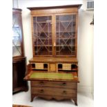 Regency mahogany secretaire bookcase with inlaid boxwood stringing. The bureau fittings are birdseye