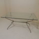 Contemporary glass top dining table with chrome base by The Chair Company 150cm long x 85cm wide x