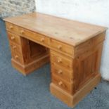 Pine twin pedestal desk. 77cm high x 120cm wide x 58cm deep