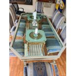 Large glass topped table and 6 chairs with gilded decoration. Some chairs need re covering