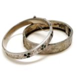 2 x antique silver bangles - 1 set with green stones in the form of shamrocks (has some dents) -