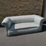 Antique blue upholstered chesterfield sofa with mahogany feet with castors. Has some staining to the