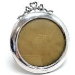 Antique silver fronted circular picture frame with ribbon detail to top & leather covered easel