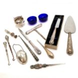 Qty of mostly silver handled cutlery / buttonhooks / paperknife etc t/w silver plated pull corkscrew