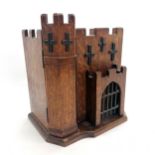 Novelty antique oak stationery cabinet in the form of a fort with castellated top & metal portcullis