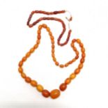 Strand of butterscotch amber beads (total weight 57.5g) t/w another strand of smaller amber beads (