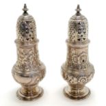 Pair of Georgian silver casters by Jabez Daniell - 14cm high & 229g. 1 has a dent to the top
