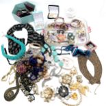 Large qty of costume jewellery inc gold tone, porcelain flower brooches, large flower necklace etc