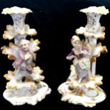 Pair of continental figural rococo style candlesticks - height 24cm ~ the female candlestick has