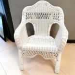 White painted wicker armchair. In good used condition.