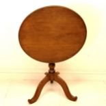 Mahogany tilt top pedestal table with a turned column & a tripod base - 72cm high & 64cm diameter In