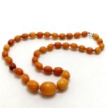 Strand of butterscotch amber beads with 9ct gold clasp - 48cm long & total weight 24g