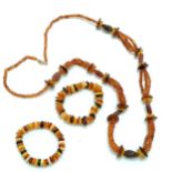 2 x amber 'stretchy' bracelets (32g total weight) t/w long strand (88cm) of horn beads