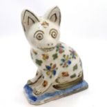 Antique Persian faience cat with floral detail to body - 18cm high & has chips to ears & losses to