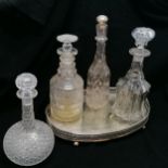 4 x decanters (tallest 32cm) - 1 has a triple neck design & profuse cutting to the body t/w oval