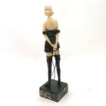 Art Deco style figure of a scantily clad female holding a whip in metal and plastics on a marble